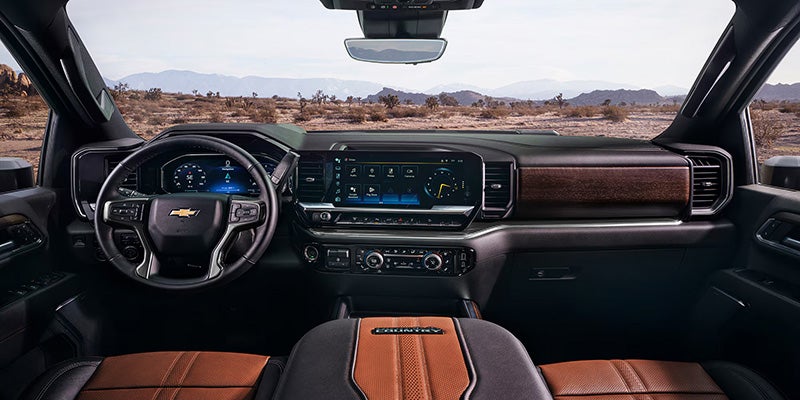 Chevrolet Silverado interior cabin with digital display, steering wheel, and premium dashboard design