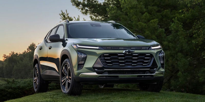 Chevrolet Equinox SUV front exterior view parked on grass with modern grille and LED lighting design.