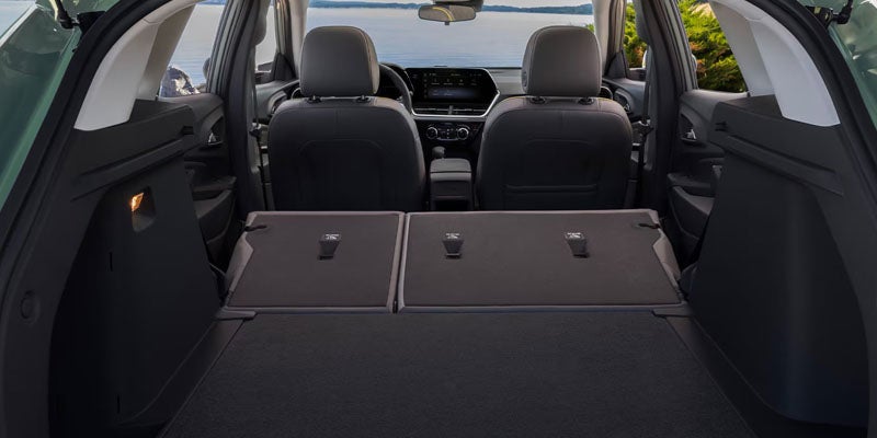 Chevrolet Equinox cargo area with folded rear seats showing flexible interior storage space.